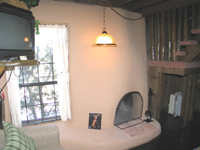 Cabin A has a Southwest-styled fireplace downstairs